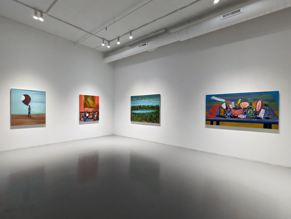 four paintings on a wall in an Exhibition